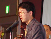 Goro Abe speaking at the award ceremony of the 2004 Japan Media Arts Festival on February 24, 2005. The festival itself took place from February 25 to March 6, 2005.