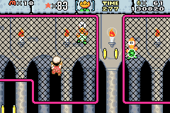 Fire Mario encountering a Climbing Koopa in #1 Iggy's Castle in Super Mario World: Super Mario Advance 2.