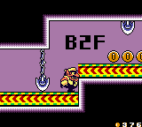 Wario evading lances on a Conveyor Belt.