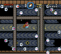Mario swimming past Disappearing Boo Buddies in the Sunken Ghost Ship.