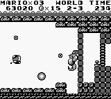 A screenshot of the battle between Mario in his Marine Pop and Dragonzamasu, lord of the Yurarin and boss of the Muda Kingdom in Super Mario Land. This was the first shooter battle in any Mario game.