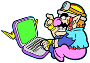 Wario sitting at his computer.