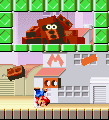 Mario doing a Handstand underneath a Brickman in Mario vs. Donkey Kong