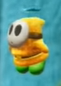 A yellow Fly Guy in Yoshi's Crafted World.