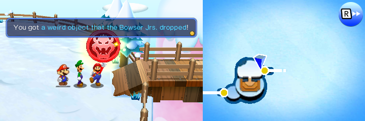 Mario picking up the Red Medallion after defeating Papercraft Bowser Jr. in Mount Brrr of Mario & Luigi: Paper Jam.