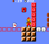 Illustration screenshot of World 1-1 (VS Game) in Super Mario Bros. Deluxe, showing, among other things, Mario, a Boo, a Face Block, and Dotted-Line Blocks.