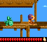 Dixie Kong holding a Steel Barrel at the Koin of Jetty Jitters in Donkey Kong GB: Dinky Kong & Dixie Kong