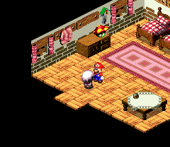 Suite guest giving Mario a gift for doing a good job as a bellhop in the hotel in Marrymore of Super Mario RPG: Legend of the Seven Stars.