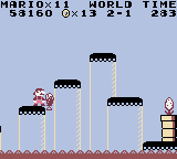 A screenshot of World 2-1 of Super Mario Land as played on the Game Boy Color, illustrating several phenomena such as yellow pipes and the lava-like appearance of water on the Game Boy Color.