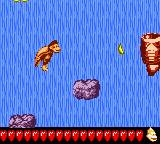 Dixie Kong jumps from two platforms to a Booster Barrel in Footloose Falls in Donkey Kong GB: Dinky Kong & Dixie Kong