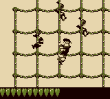 Diddy Kong climbing up a grid of ropes with some slithering Slippas in Riggin' Rumble from Donkey Kong Land
