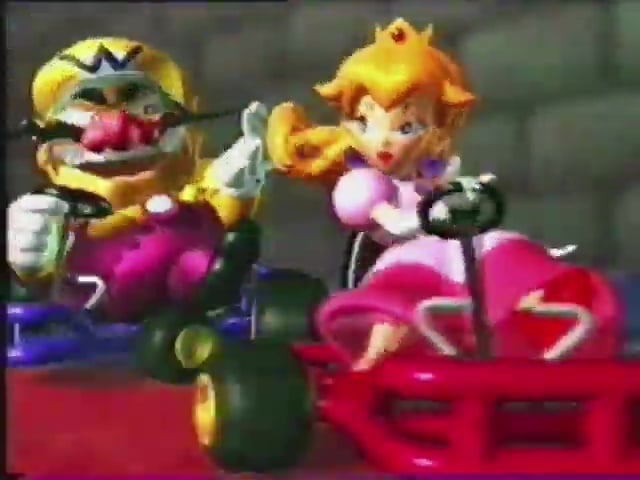 File:MK64 commercial EU Wario & Peach.jpg