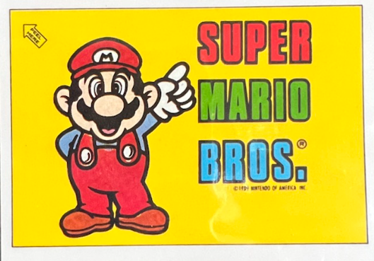 File:Nintendo Game Pack UK 13 Mario Pointing at Super Mario Bros logo.png