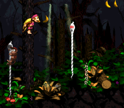 Dixie and Diddy Kong crossing a pit via ropes in Ghostly Grove of Donkey Kong Country 2: Diddy's Kong Quest