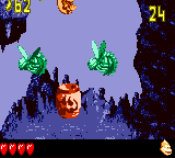 Dixie Kong blasting from a Boo Barrel in the second Bonus Level of Stalagmite Frights in Donkey Kong GB: Dinky Kong & Dixie Kong