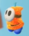An orange Fly Guy in Yoshi's Crafted World.