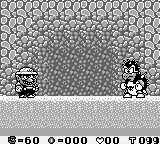 Wario facing the Spiked Koopa, the boss of Rice Beach, in Course 5.