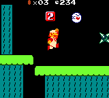 A screenshot of World 2-1 (VS Game) in Super Mario Bros. Deluxe, showing, among other things, Fire Mario, a Boo, a 3-2-1 Block, and a Spike Trap.