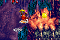 The Kongs and Squitter reach the Bonus Coin at the end of the second Bonus Level in Creepy Caverns in the Game Boy Advance remake of Donkey Kong Country 3.