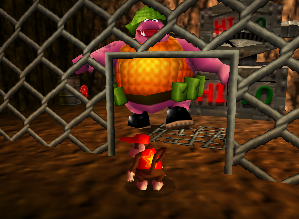A red Banana Coin next to a machine in Jungle Japes.