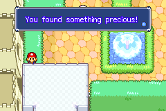 Mario picking up the Precious Belonging in Toadtown Square of Mario & Luigi: Superstar Saga.