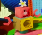 Fin Blockafeller in the Pastel Pathway world in Yoshi's Crafted World.