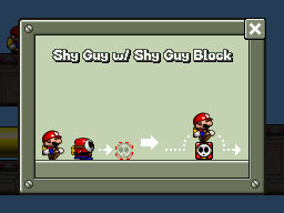 A screenshot of the Help Mode screen for Area 8-1 in Mario vs. Donkey Kong: Mini-Land Mayhem!, demonstrating how to use a Shy Guy Block.