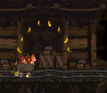 The Kongs ride under some bananas at the beginning of the level
