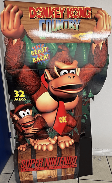 File:DKC Promotional standee.png