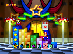 Game Guy's Lucky 7: Mario standing on the second pillar; and above him is a rolling die waiting to be hit. From Mario Party 3.