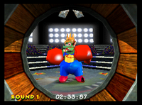 Donkey Kong about to blast into King Krusha K. Rool from a Barrel Cannon in Donkey Kong 64