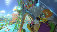 Wario driving in the Water Park course in Mario Kart 8