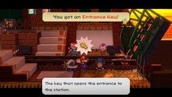 Mario getting the Entrance Key from a station worker in Riverside Station of Paper Mario: The Thousand-Year Door for Nintendo Switch.