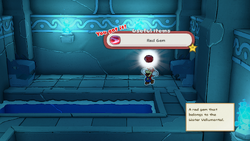 Mario holding the Red Gem in Sea Tower of The Origami King.