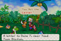 Mario receiveing a Letter from red Yoshi Kid in the Yoshi's Village of Paper Mario.