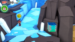 Mario standing near a 100-Coin on Diamond Island of The Origami King.