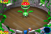 Mario, as a pinball, battling Petey Piranha.