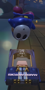 Blue Shy Guy performing a trick.