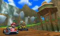 Mario and Bowser race in DK Jungle. DK's treehouse is on the right.