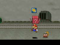 Screenshot of Mario revealing a hidden ? Block (containing a Pretty Lucky badge) in Rogueport Sewers, in Paper Mario: The Thousand-Year Door.