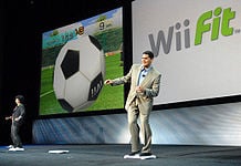 Reggie and Shigeru Miyamoto playing Wii Fit.