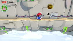 Mario standing near a 10-Coin in Spring of Rainbows of The Origami King.