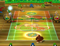 Donkey Kong and Diddy Kong participate in a Singles match on the DK Jungle Court in Mario Power Tennis
