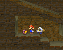 Mario near the P-Up, D-Down badge in Riverside Station of Paper Mario: The Thousand-Year Door.