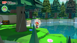 Mario standing near a tree containing a Small Bag of Confetti in Whispering Woods of The Origami King.