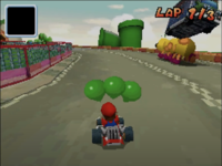 Wiggler running through a car in Mario Kart DS