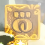 A large glyph-shaped coin, from Yoshi and the Mysterious Book