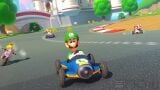 Racers passing Peach's Castle on DS Mario Circuit