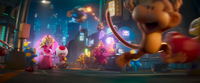 Peach and Toad chasing an Ukiki in The Super Mario Galaxy Movie