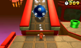 Tanooki Mario being chased by a giant spiked ball in World 8-1.
